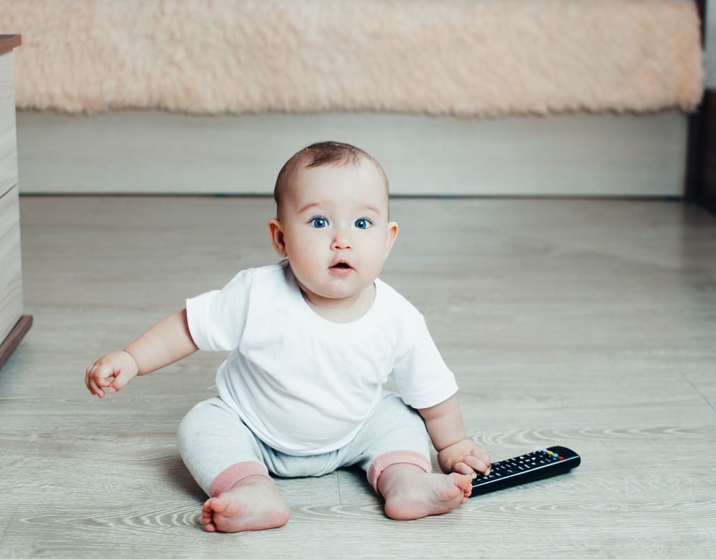 Baby With Television Remote