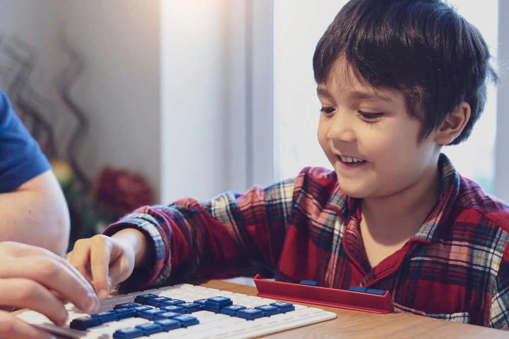 boy playing Scrabble