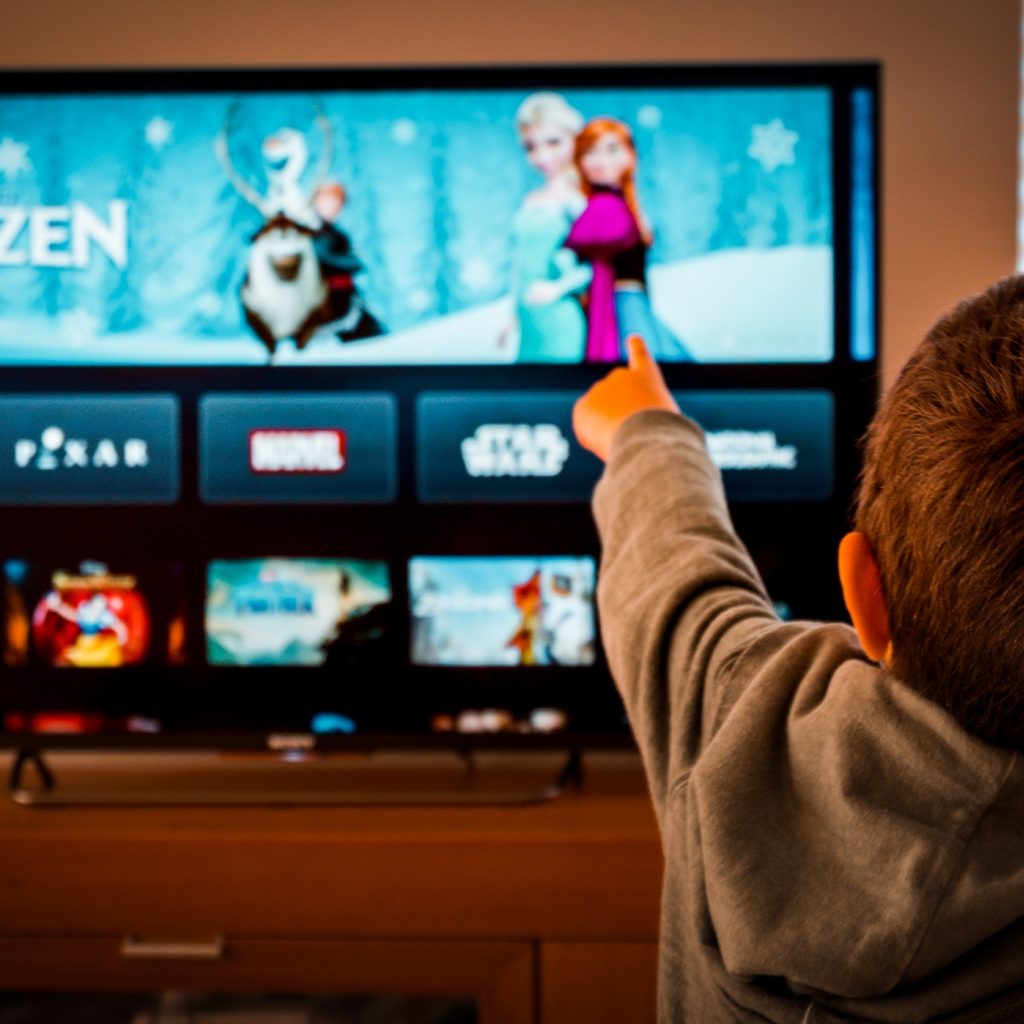 Boy watching Disney+ on TV