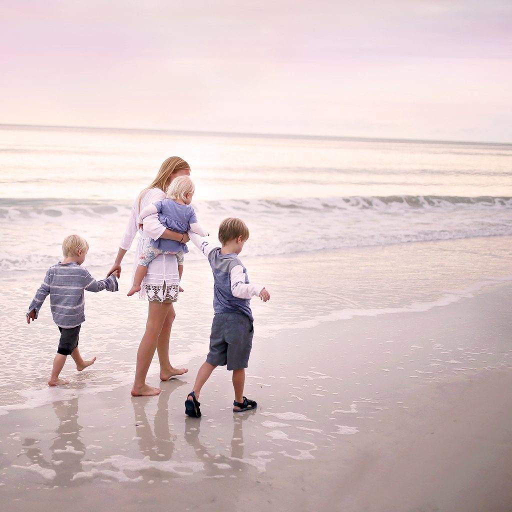 Family walks on a beach
