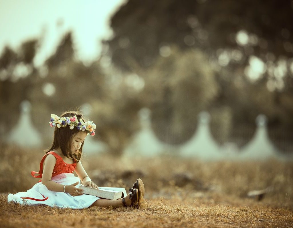 Girl On Ground In Dress Playing