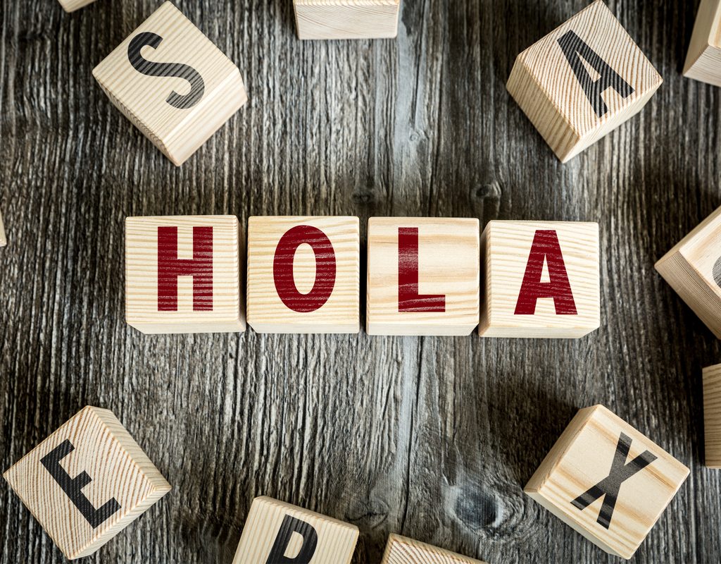 letter blocks spelling the Spanish word hola.