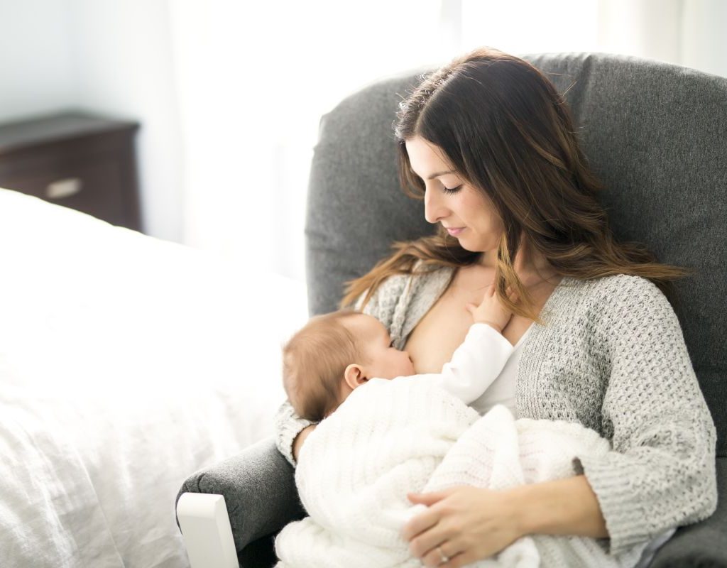 A mom and baby breastfeeding