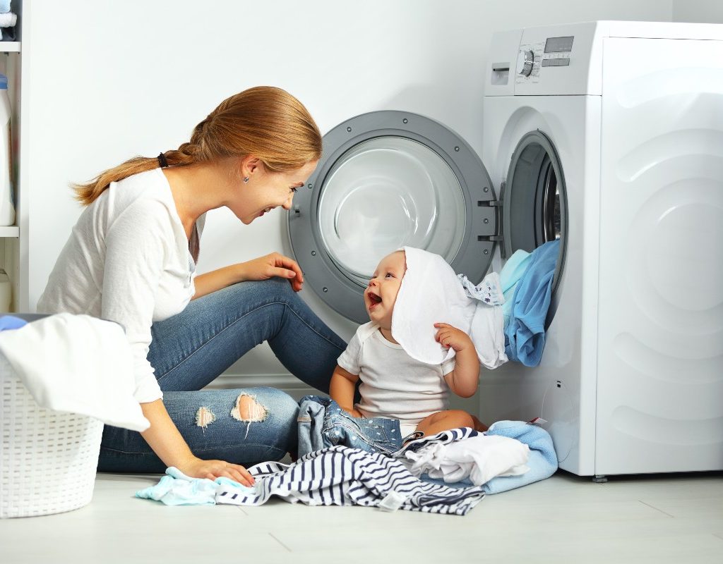 mom and baby doing laundry