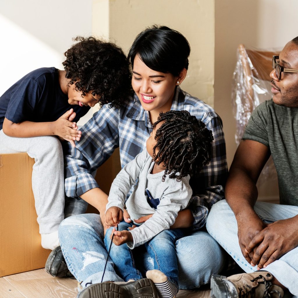 Mult-racial family moving with kids