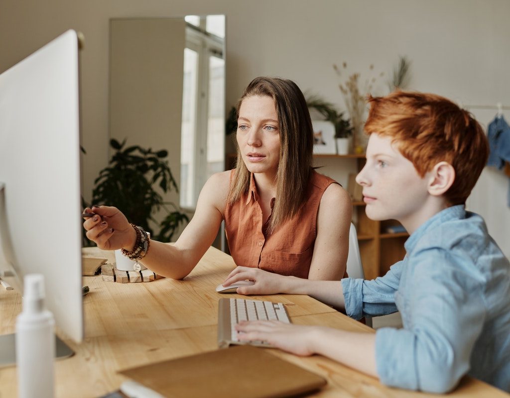 parent helping her child to answer a question about Black History Month