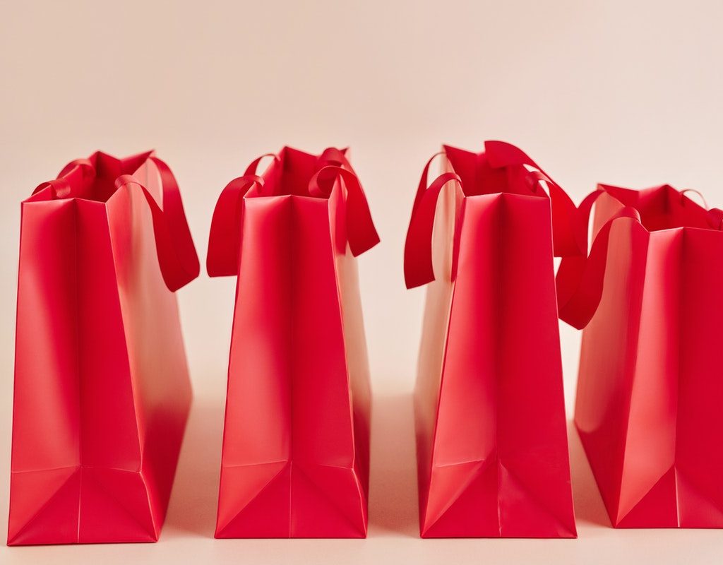 Four red goodie bags