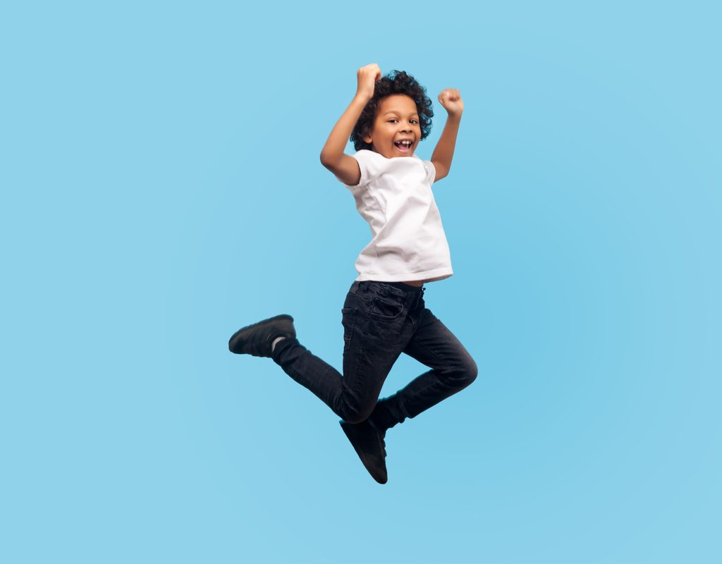 boy having fun jumping on a trampoline