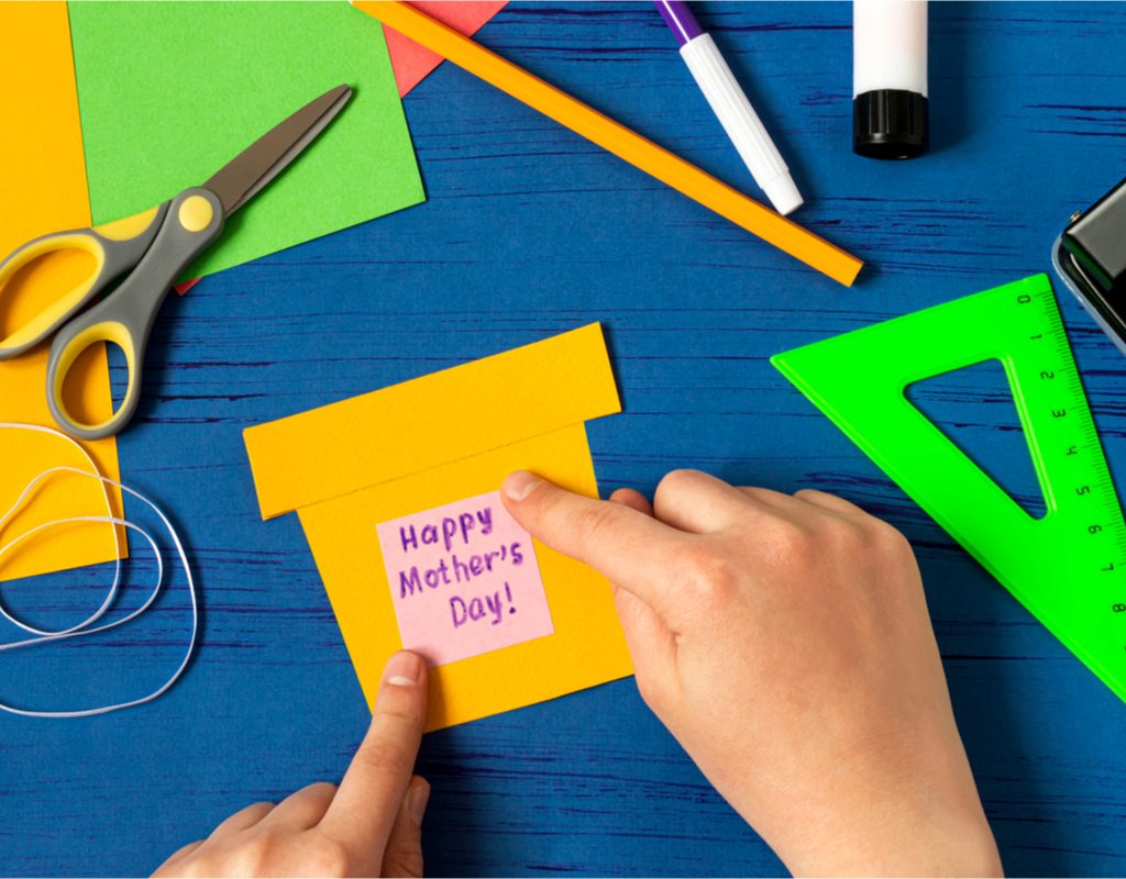 Child making a DIY gift for mom on Mother's Day