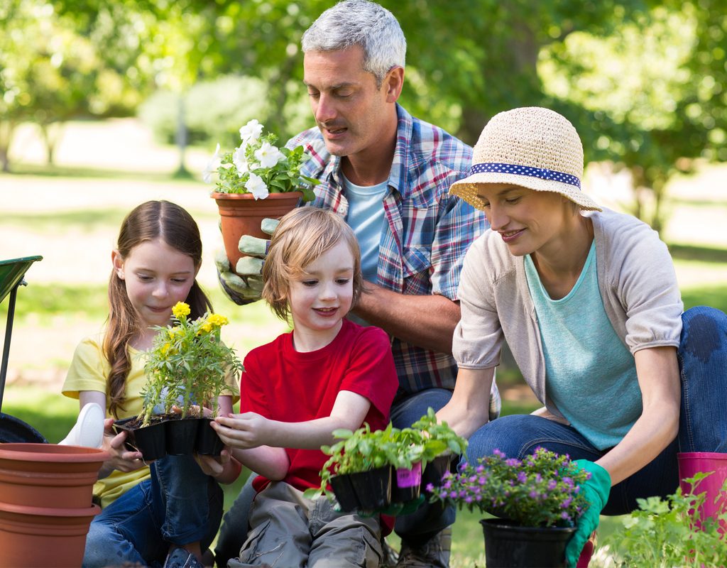 family having fun gardening on Mother's Day