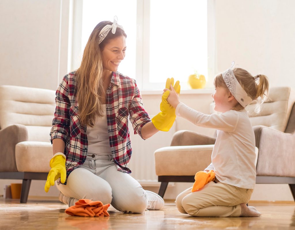 mom and daughter spring cleaning together