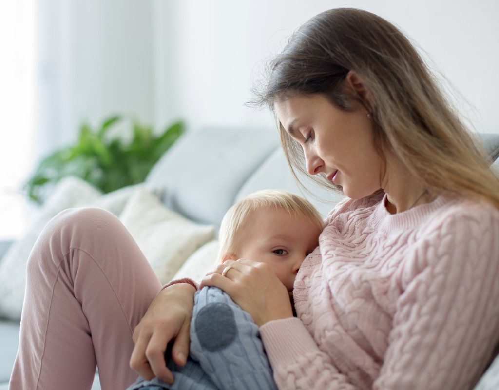 Mom holding and breastfeeding baby