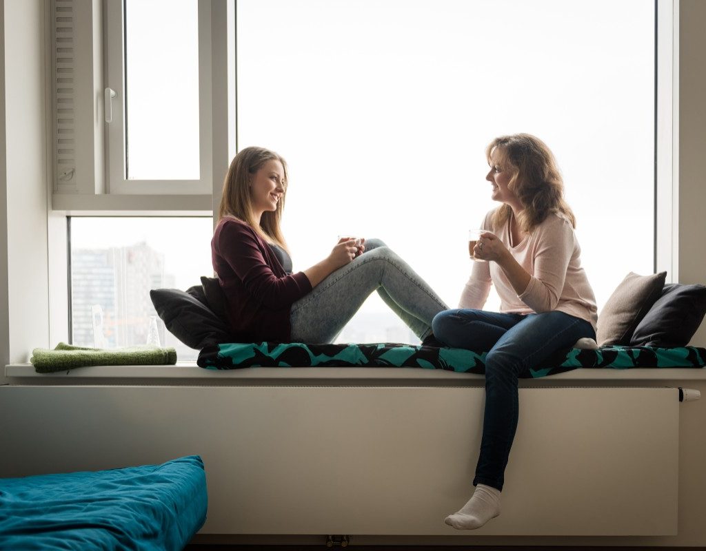 A parent and teen talking.
