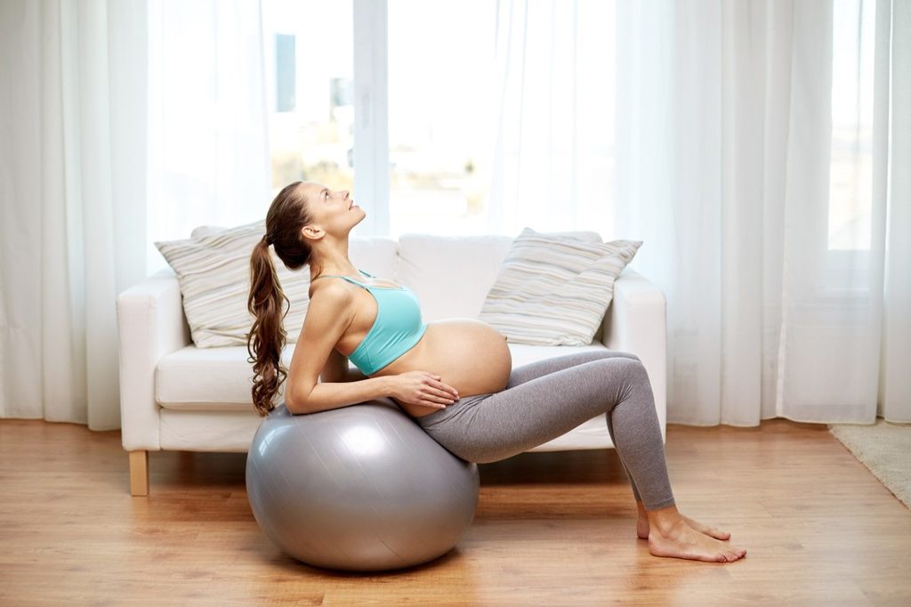 A pregnant woman doing a core exercise