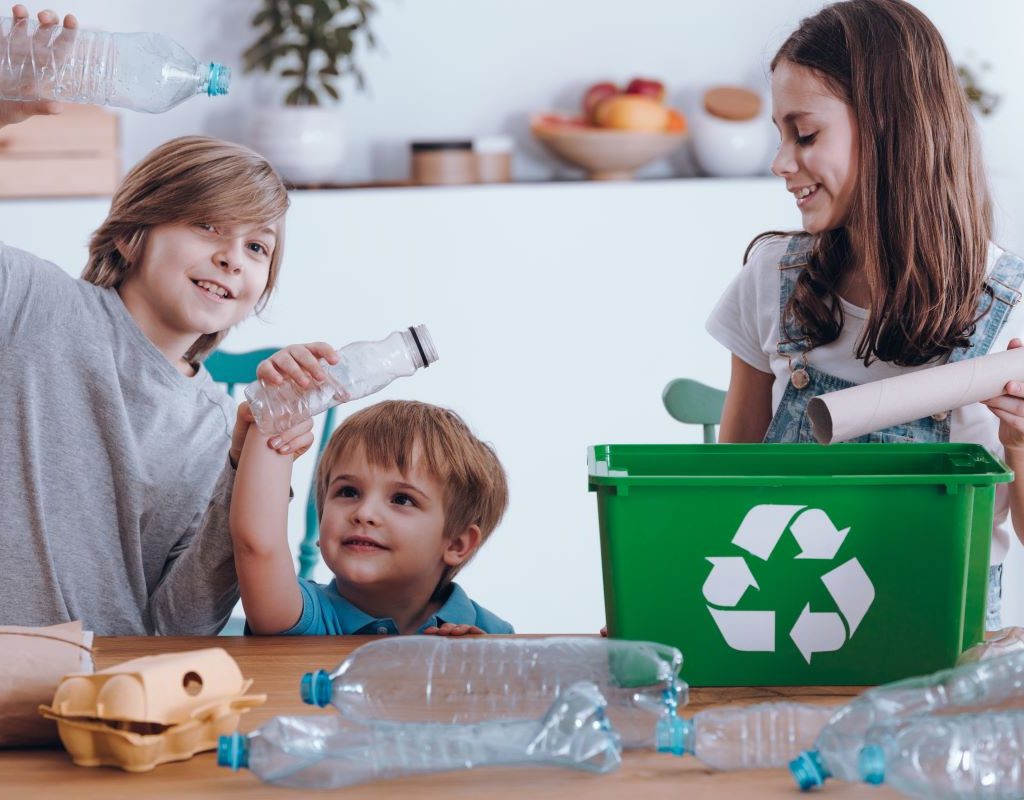 siblings sorting recyclable material