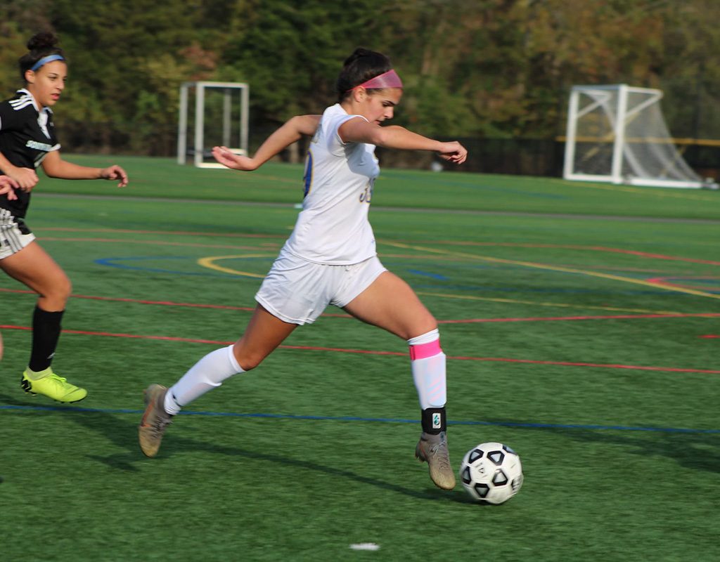 Amanda Mendez looks to score in a high school soccer game