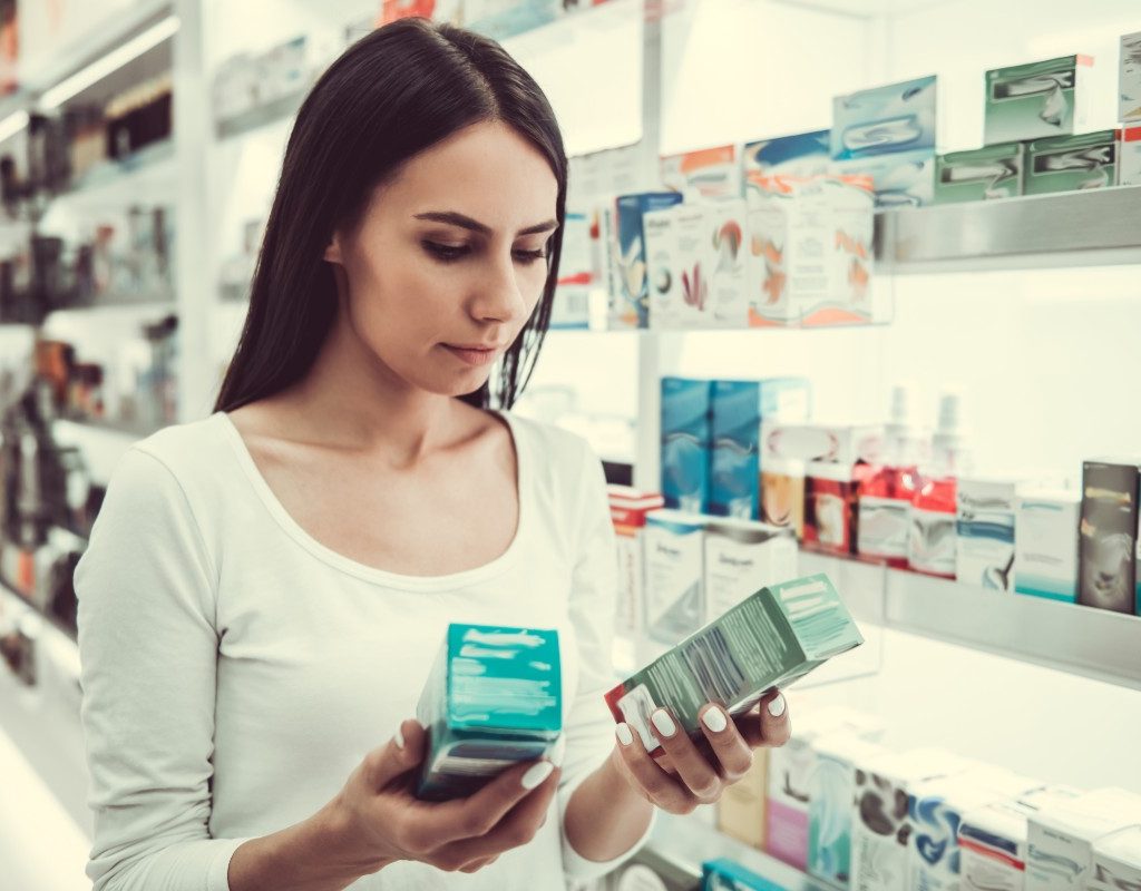 Woman comparing medications