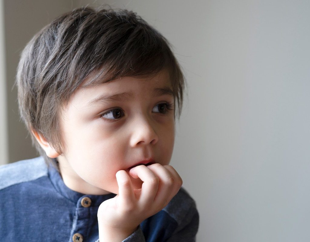 boy biting nails