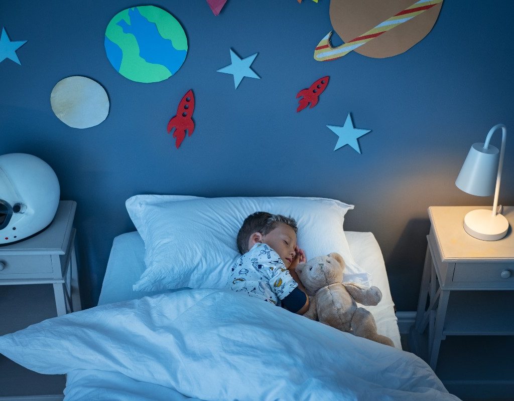 boy sleeping in bedroom