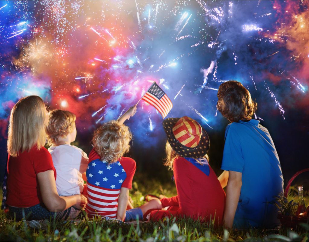 Family enjoying fireworks at night
