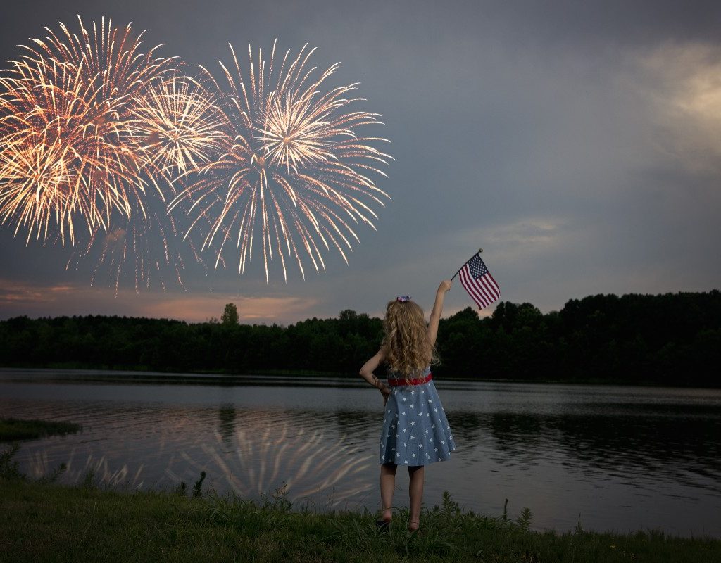 Fourth of July fireworks watched by a girl