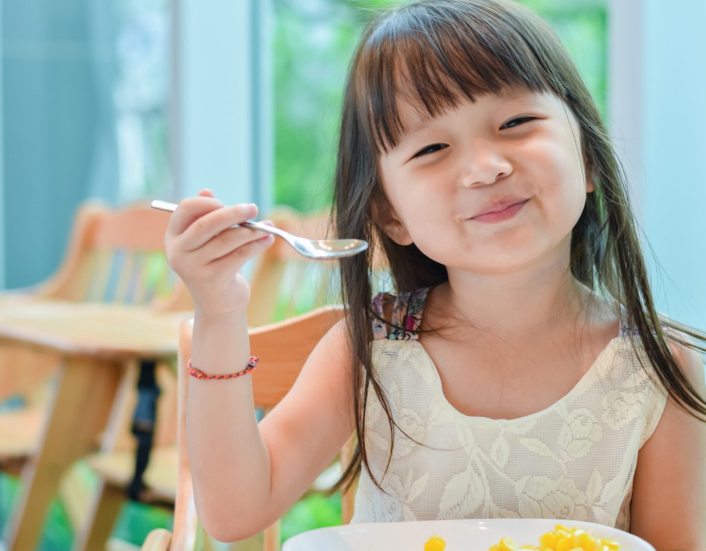 happy girl with spoon