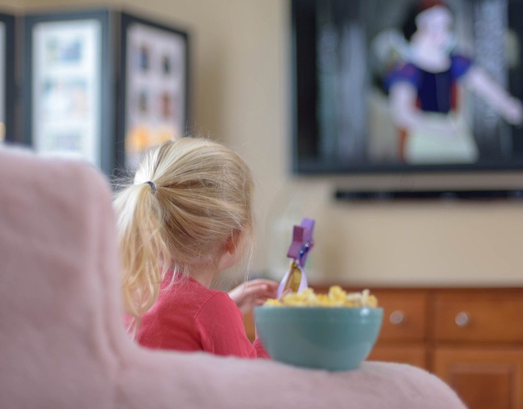 kid watching tv at home