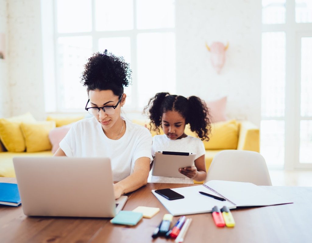 Mom working from home with daughter