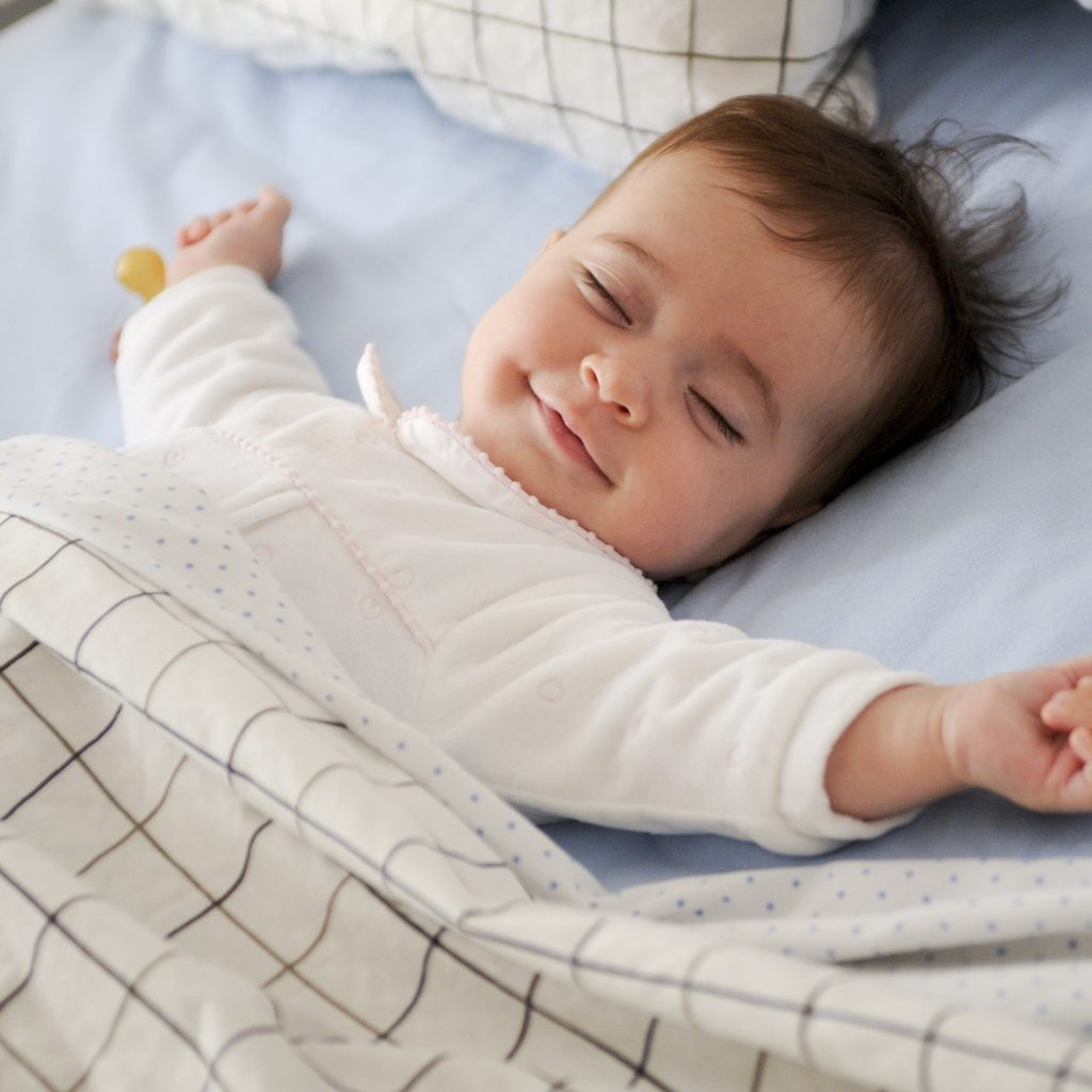 Smiling baby sleeping