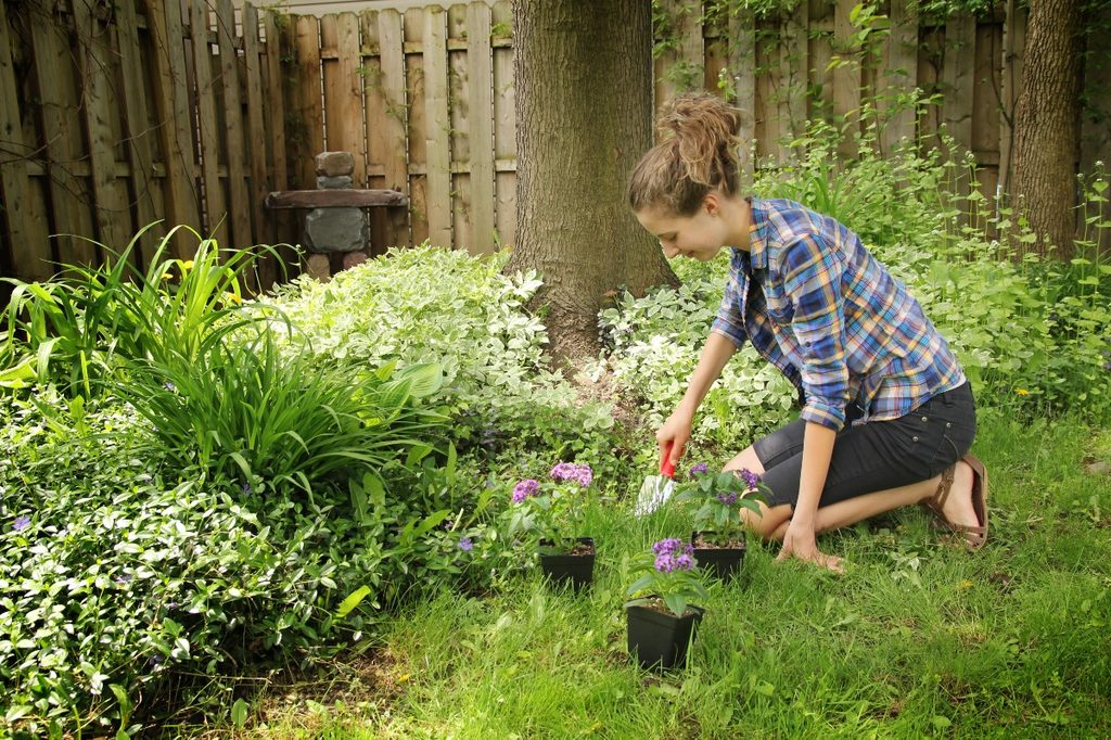 Teen girl gardening.