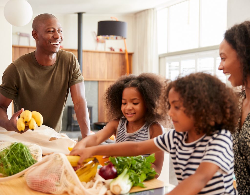 family unloading groceries