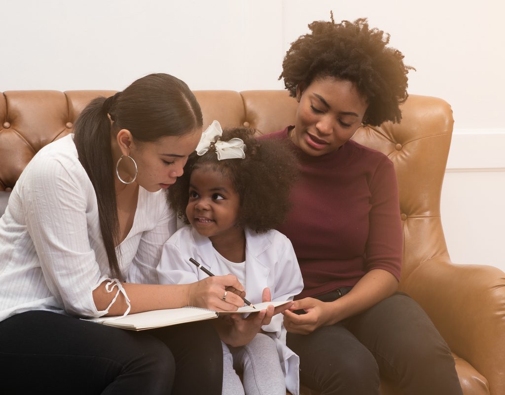 Family reading together on couch