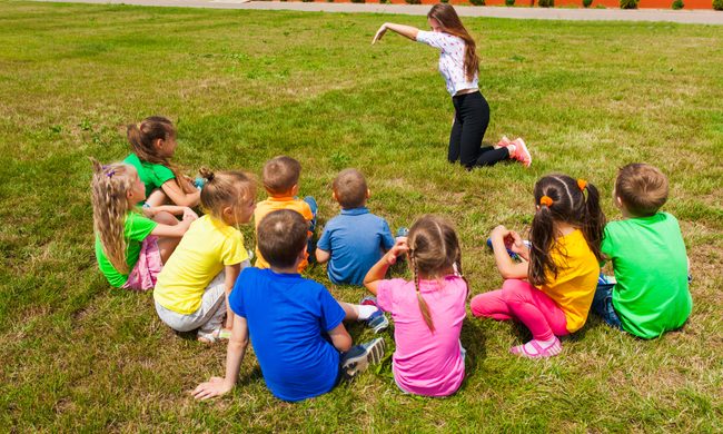 Group of kids playing improv game outside