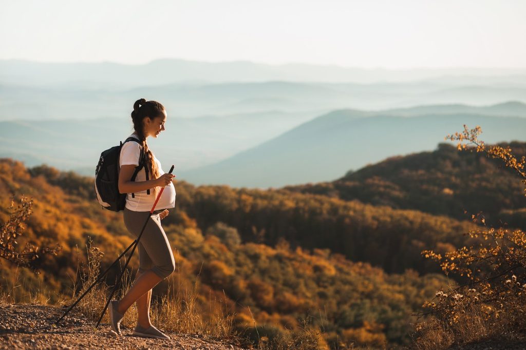 Pregnant woman on hike.