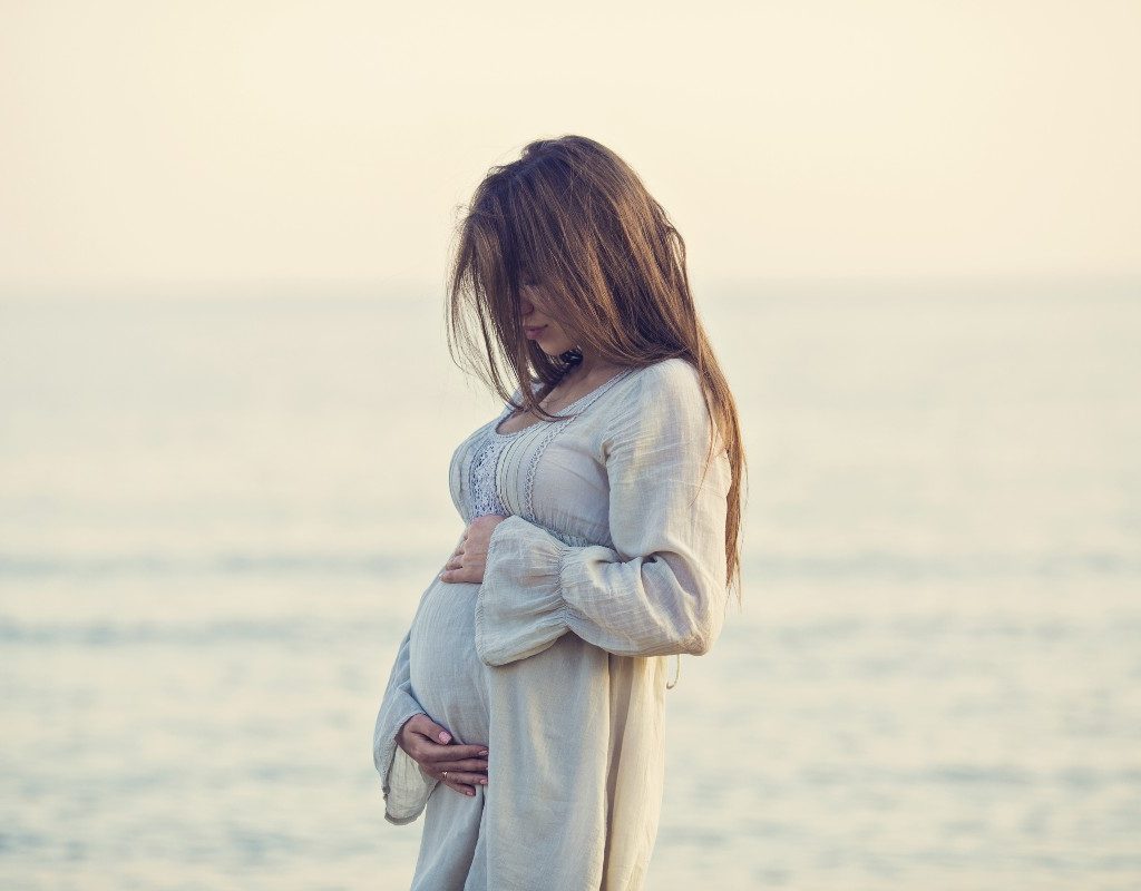 pregnant woman on beach