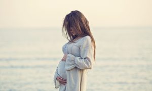 Pregnant woman on a beach