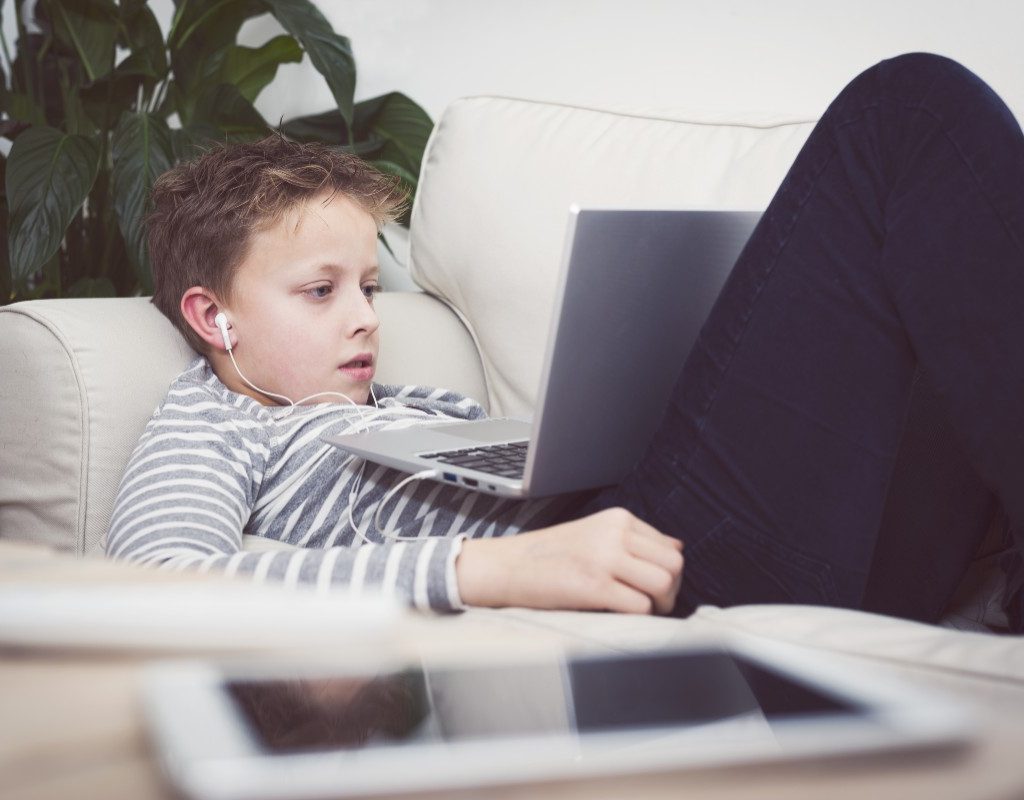 Teen streaming on his computer