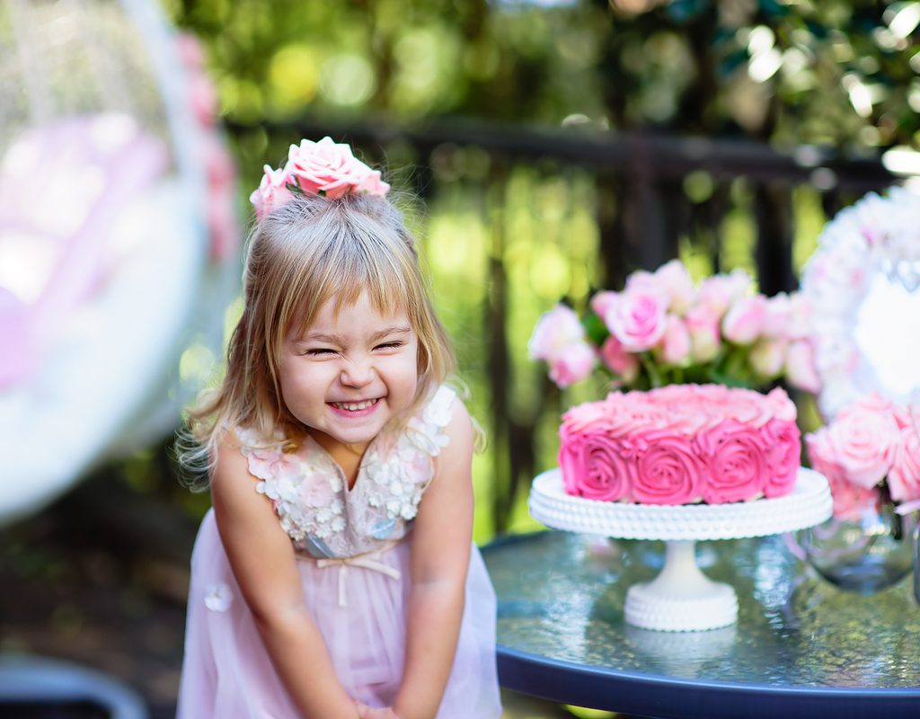 Toddler girl celebrating summer backyard birthday