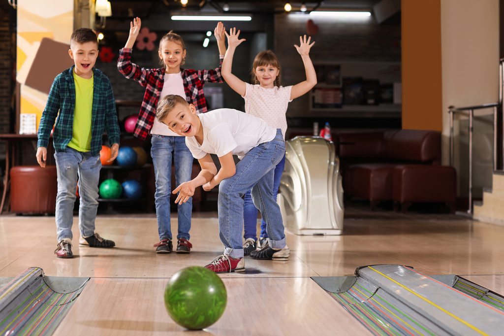 Kids having fun at a bowling birthday party