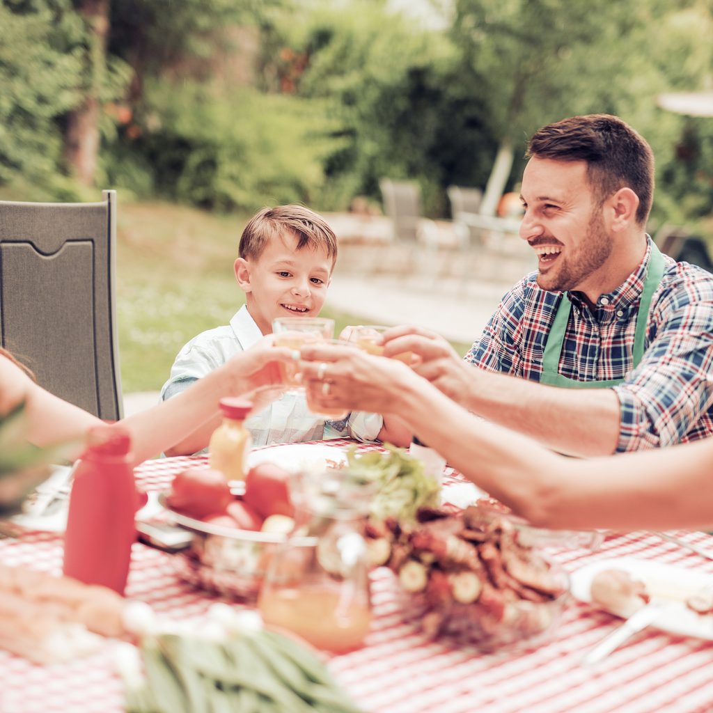 Family eating dinner outdoors
