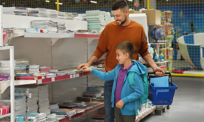 Dad and son doing some back to school shopping