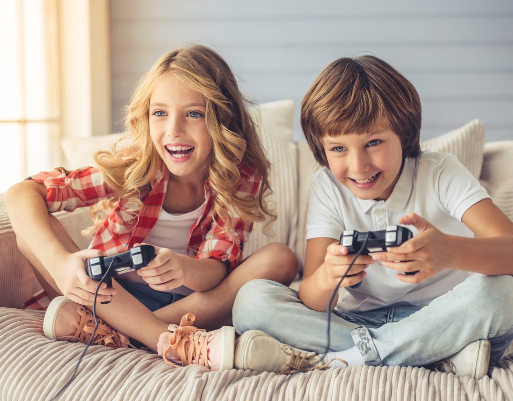 Two kids having fun playing video games