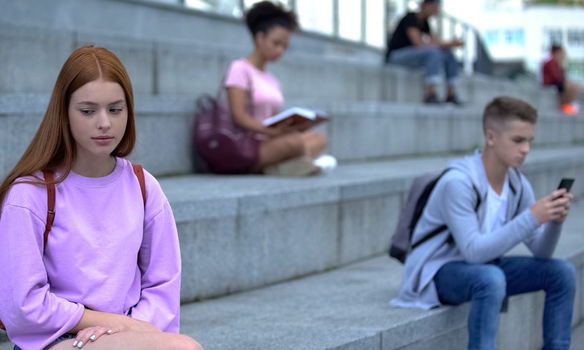 Teens ignoring each other