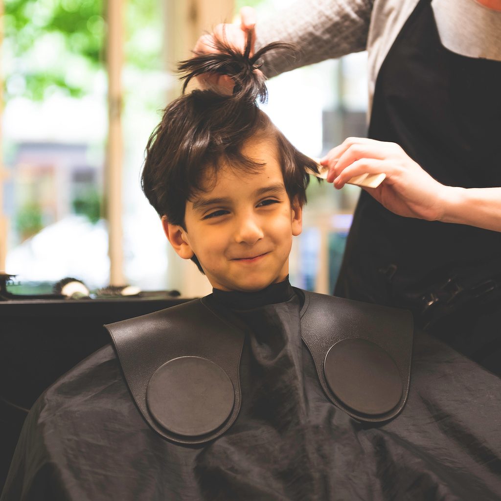 Child getting hair cut