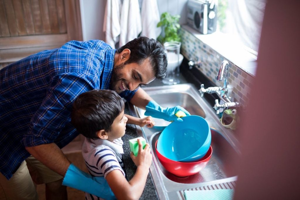 son helping dad with chore