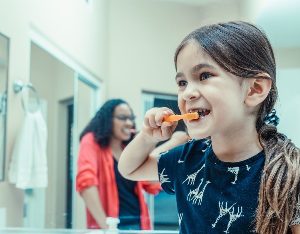 Kids brushing their teeth