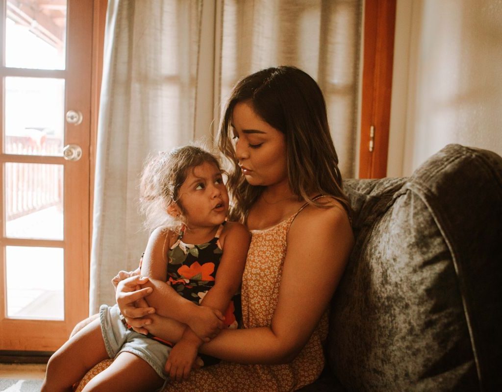 mom and daughter in grass