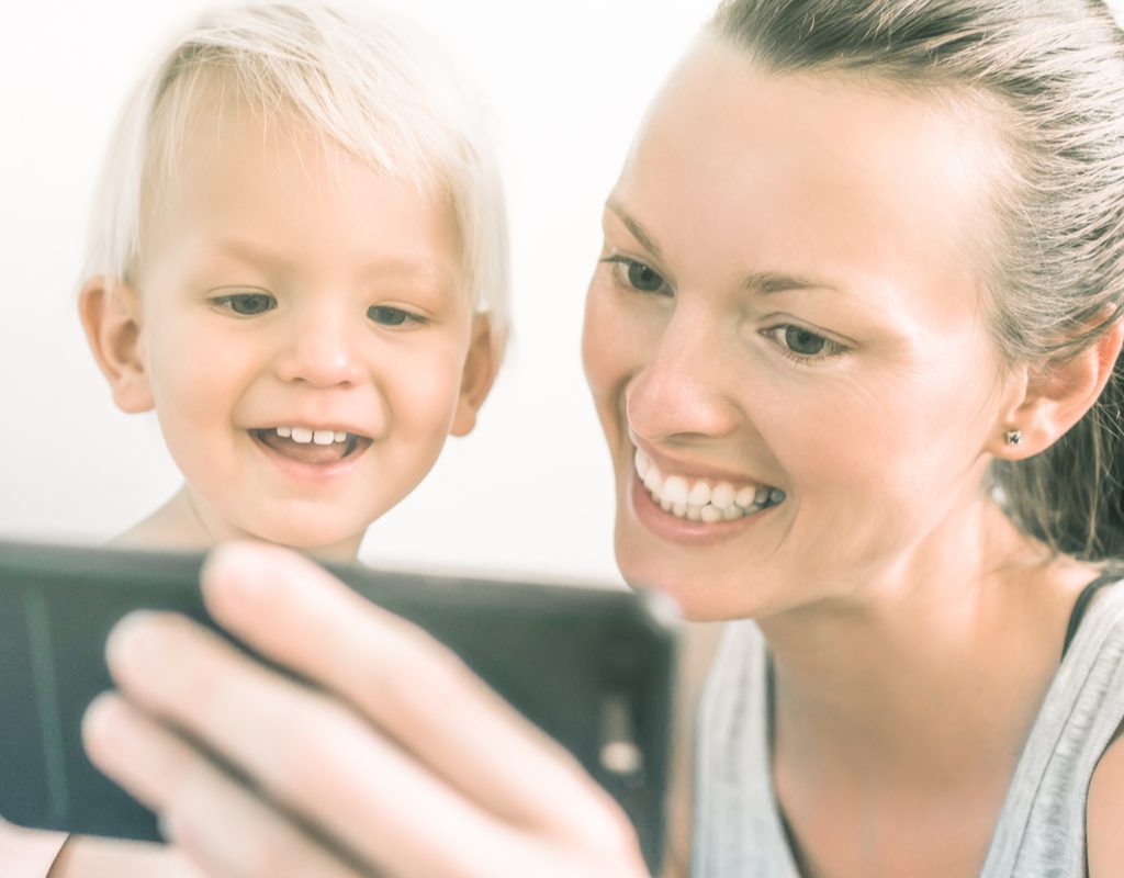 mother and son watching smartphone