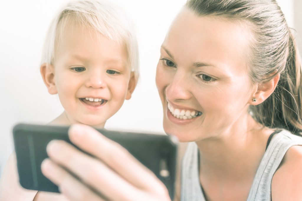 mother and son watching smartphone