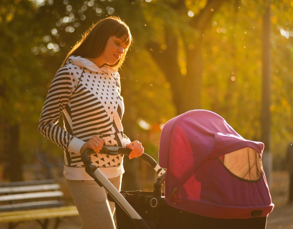 Mom Pushing Baby In Stroller
